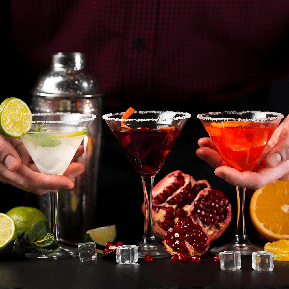Bartender mixing cocktail with shaker and garnish