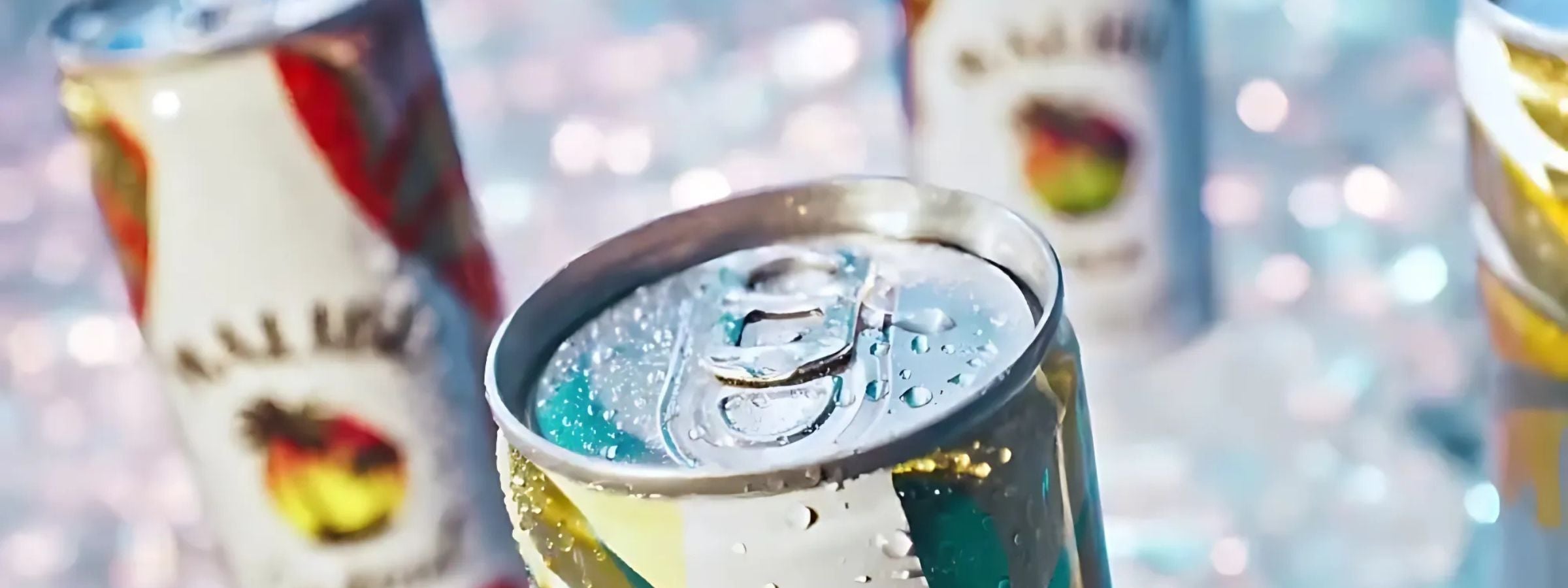 Cans of pre-mixed cocktails stacked in fridge