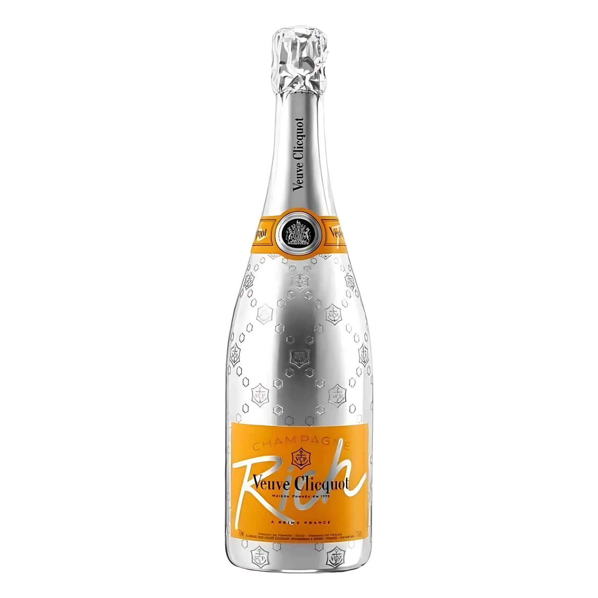 A bottle of Veuve Clicquot Ponsardin Rich Champagne with a silver foil cover and an orange label.