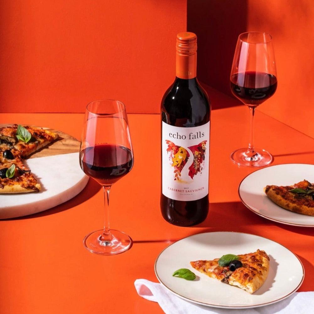 Echo Falls Cabernet Sauvignon 75cl bottle with wine glass, grapes, and rustic table setting