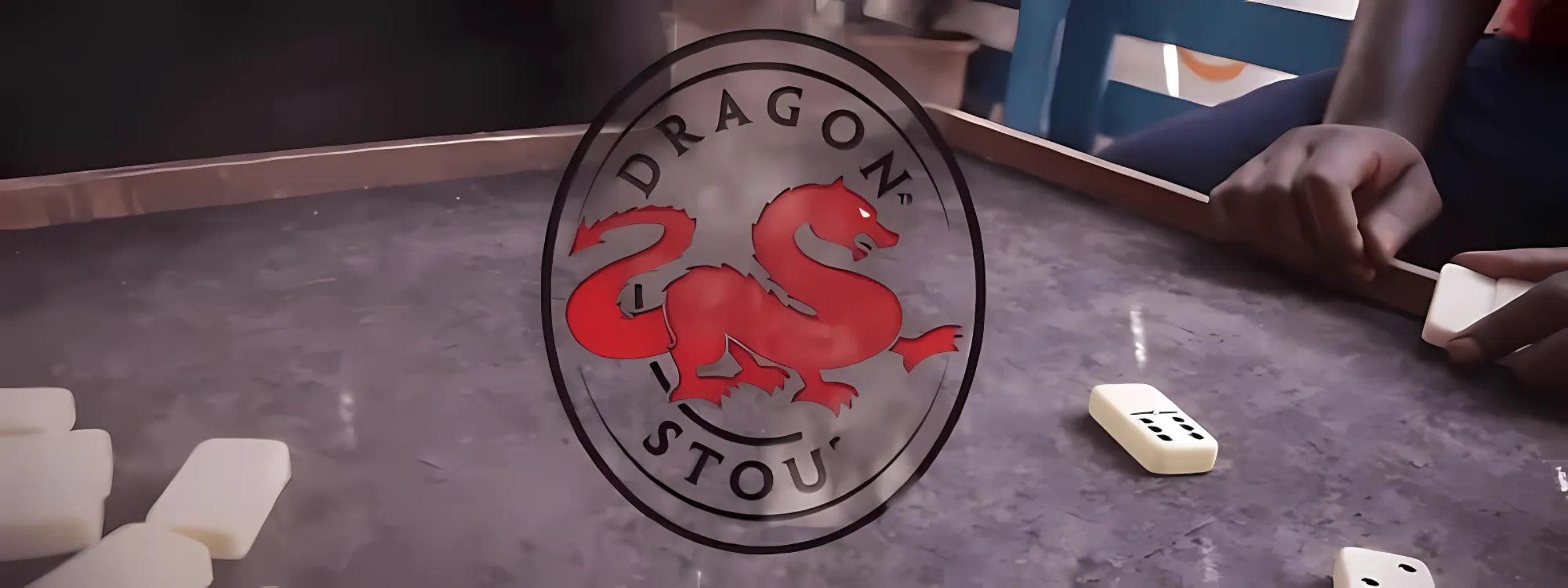 Dragon Stout bottle with bold label design, showcasing Jamaica’s iconic strong dark beer.