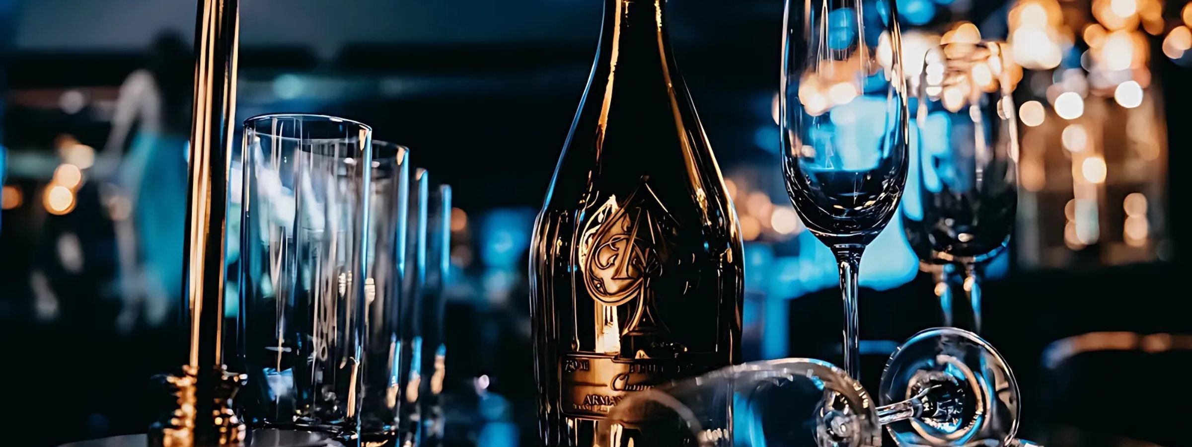 Armand De Brignac champagne bottles with gold foil and elegant packaging