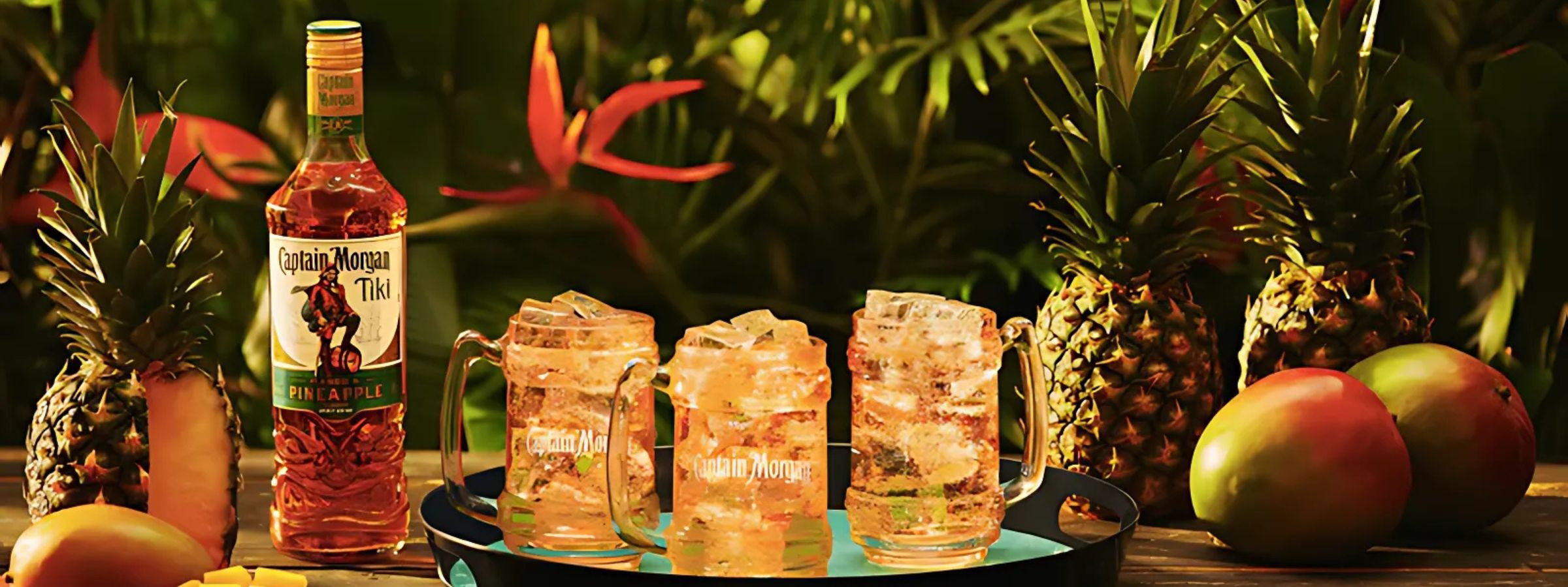 Captain Morgan rum bottles with cocktail garnishes