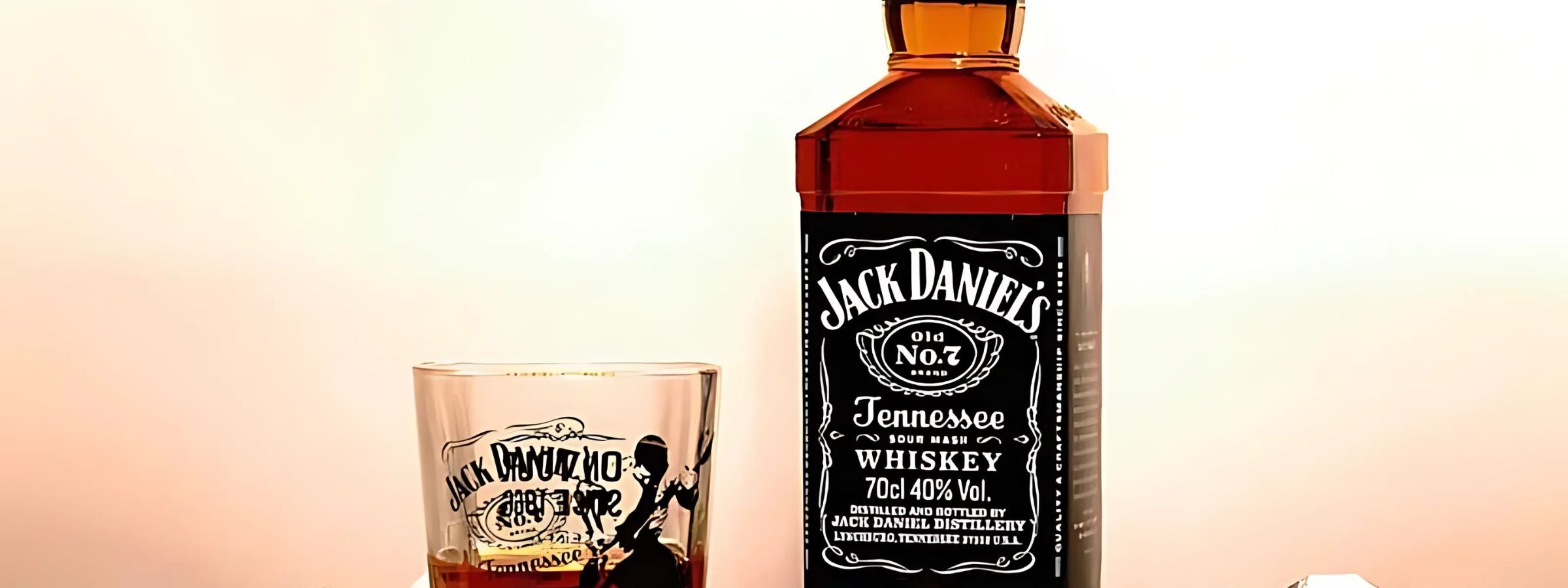 Jack Daniel’s whiskey bottles (Old No. 7, Honey, Fire) with glasses and rustic wooden bar setup